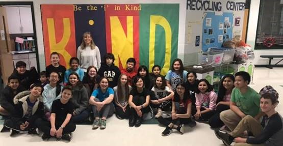 group of students in front of Kind Display